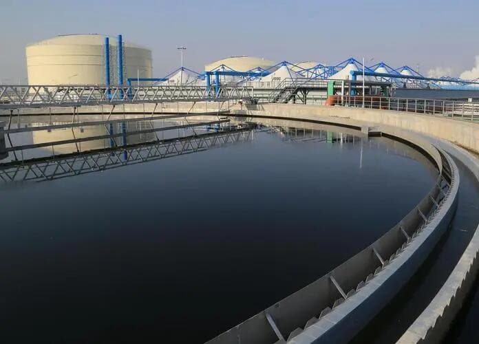 Circular radial-flow clarifier at a municipal wastewater treatment plant - secondary settling tank where polyacrylamide flocculant aids solid-liquid separation