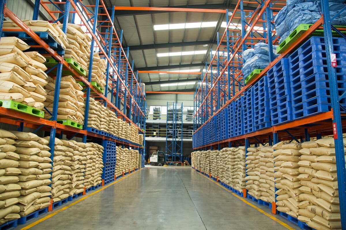 CPAM bulk storage in warehouse with 25kg bags on pallets