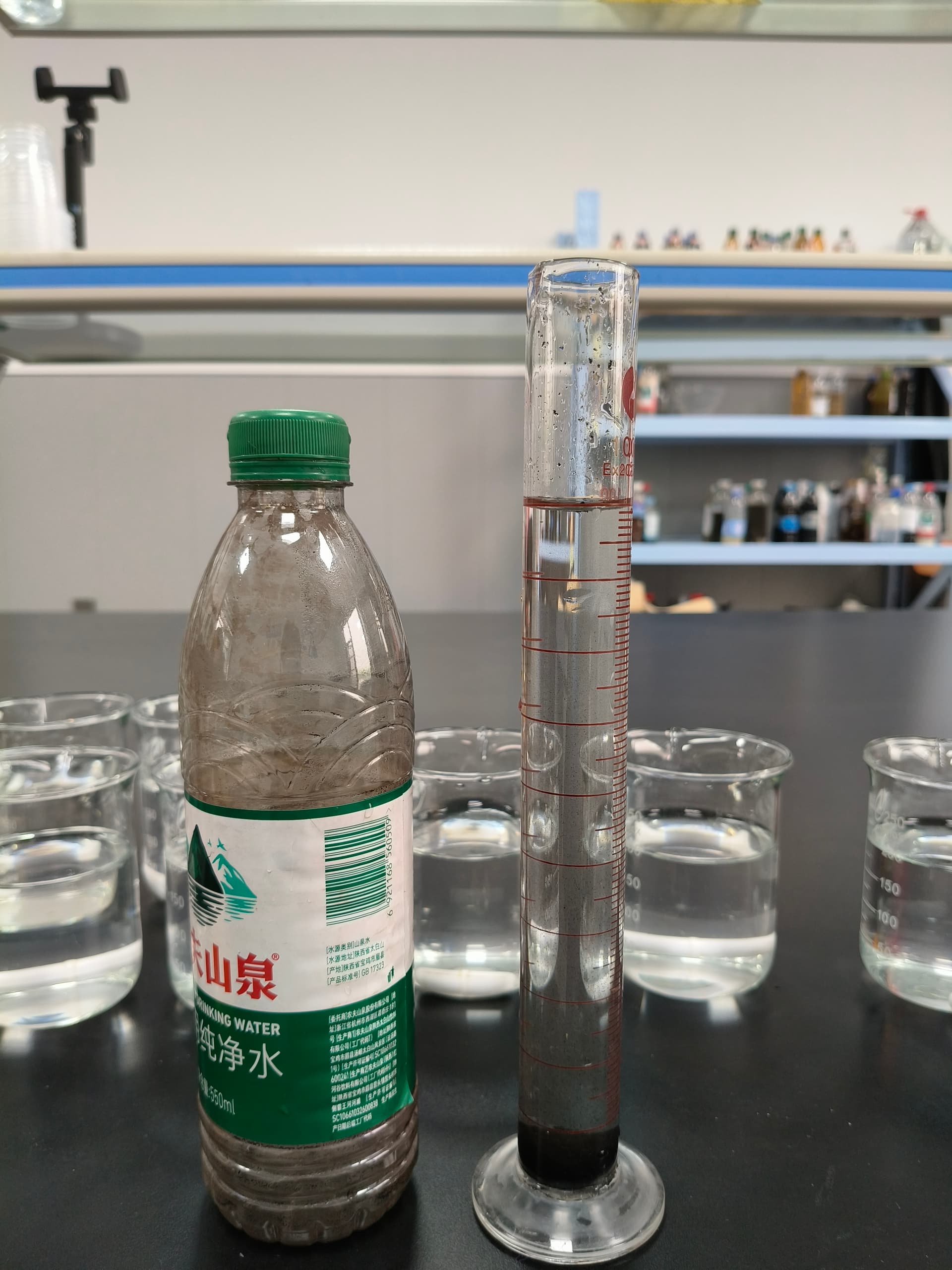 Settling cylinder test showing clear supernatant above settled solids — standard validation method for PAM grade substitution