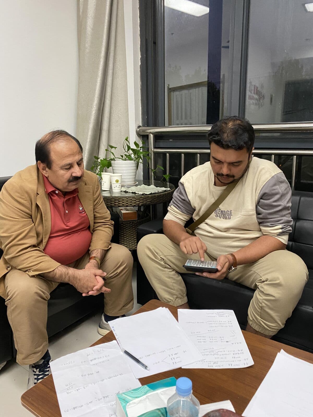 Business meeting with international clients discussing PAM requirements