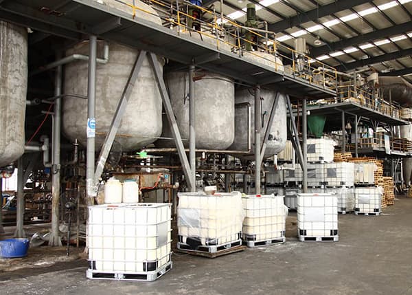 Polyacrylamide powder production and bagging equipment inside an industrial factory