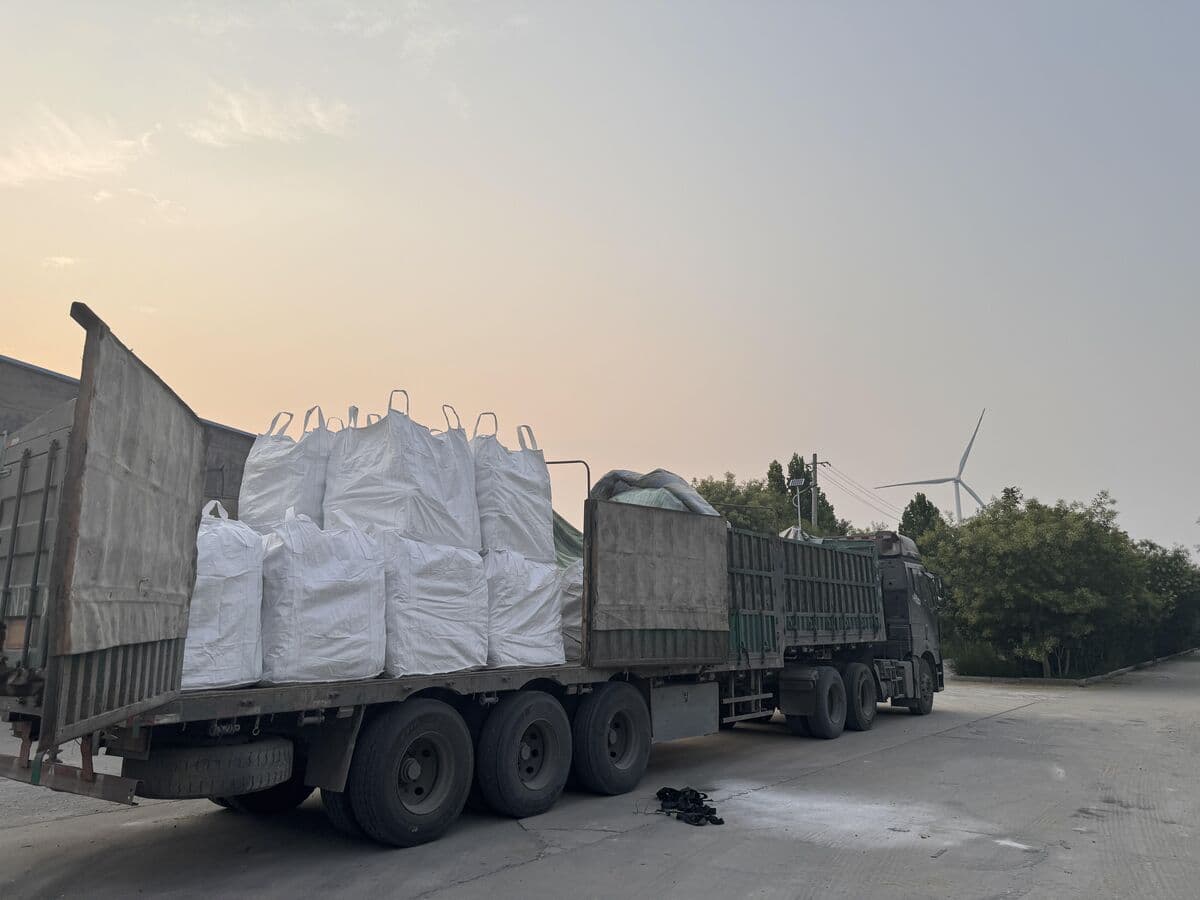 Truck loaded with bulk bags of polyacrylamide at factory gate